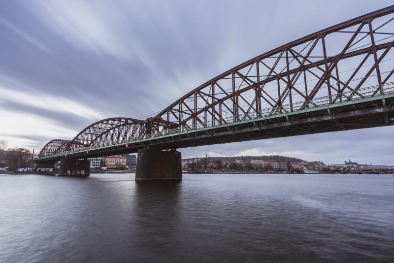An arched bridge spanning over the river.