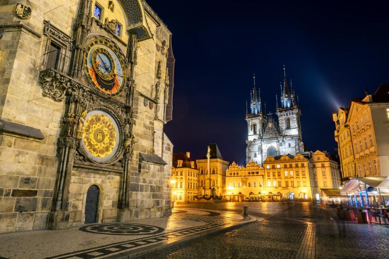 Historic square glowing with night lights.