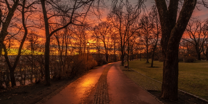 Letna Park walkways under pink sunset sky